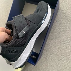 Brand new in box spin shoes. Size 8. Brand is Tiem